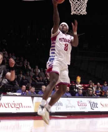 Potawatomi Fire small forward K.D. Moore catches a long pass and sinks the basket during the March 23, 2024 home game with the Texas 7ers. The 2023 TBL National Champs continued their winning streak with a final score of 141-119. File photo
