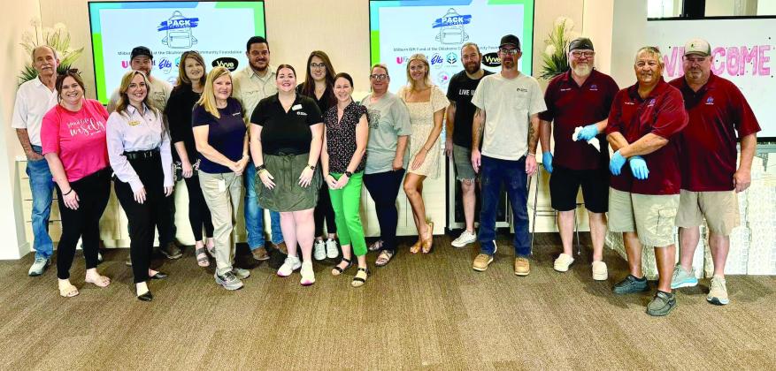 Volunteers from partner organizations serve to make Pack the School a success