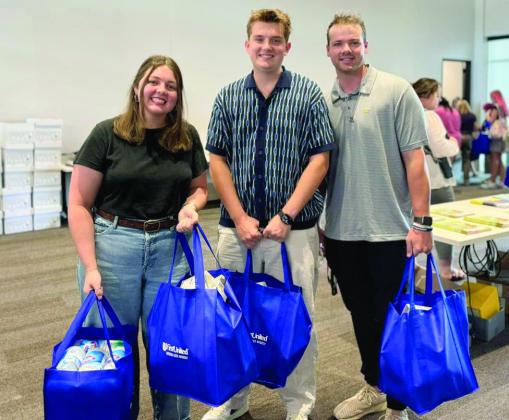 Volunteers from partner organizations serve to make Pack the School a success