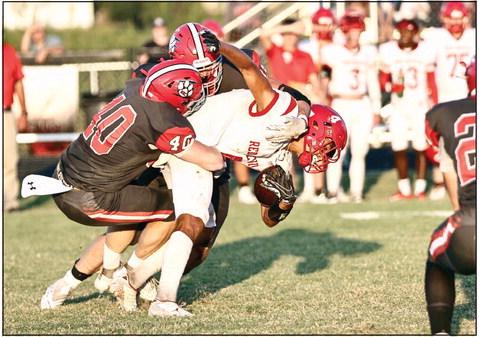 North Rock Creek’s Blain Robison makes the tackle in action Friday night against Prague. NRC lost the game 34-26 making their record this season 1-1. NRC face Holdenville Friday, Sept. 15. Photo courtesy of Gowin Photography.