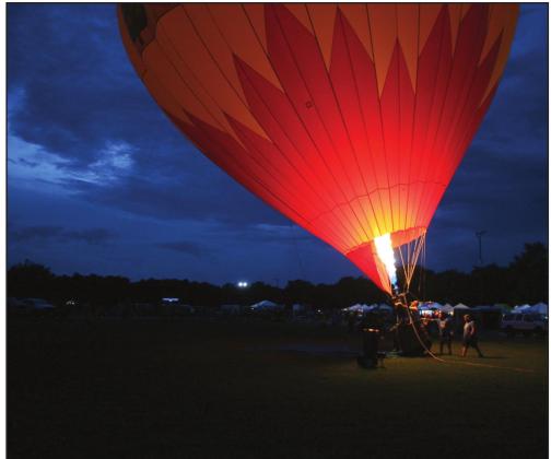 The Arbor MD balloon, piloted by Darrell Duer, lights up the sky. It was one of three balloon teams from Oklahoma City that attended Firelake Fireflight Balloon Fest 2021. Countywide &amp;amp; Sun/Kendra Johnson