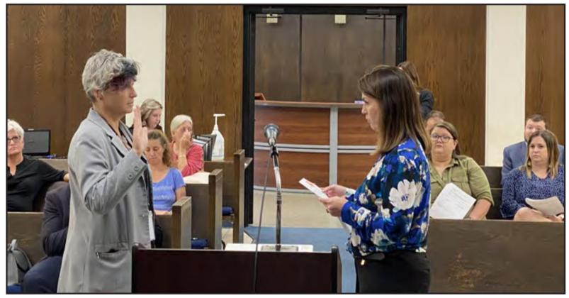 Shawnee City Clerk Lisa Lasyone swears in Andrea Weckmueller-Behringer as the new City Manager.