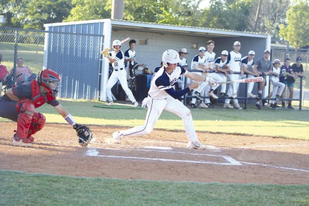Asher junior Kelby Fowler hits a double in the third inning of the Sept. 25 home game, as Dale senior Ethan Douglas watches. The Indians lost to Dale, 9-15, but they won their Class B Regional Tournament on Sept. 28-29, beating Hammon twice and losing once to Calumet. Asher advanced to the State Quarterfinals on Oct. 5 at Edmond Santa Fe High School and lost to Ft. Cobb-Broxton, 2-12. The Asher Indians end their season with a record of 16-14. Countywide &amp;amp; Sun/Natasha Dunagan