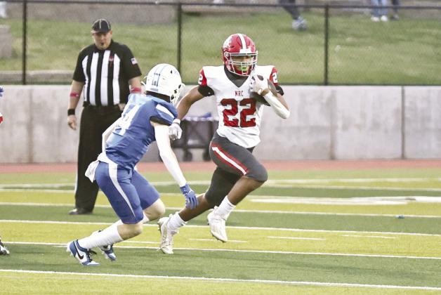 North Rock Creek’s Caleb Hawkins on his way to one of his five touchdowns in the win against Mount St. Mary’s. Photo courtesy of Gowin Photography