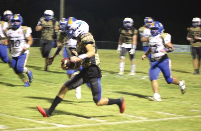 Bethel freshman Bryce Tapley runs down the sideline during the district home game against Holdenville on Military Night, Oct. 14. Bethel won 67-13. Countywide &amp;amp; Sun/Natasha Dunagan