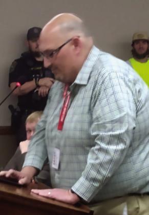 McLoud Elementary Principal Andrew Winters delivers comments of strong support for McLoud Police Chief Kyle Webb. Bill Rooth, Countywide &amp; Sun