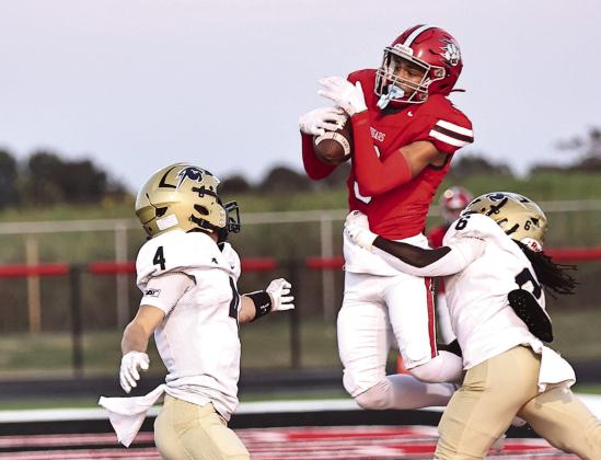 Tyson Hawkins makes a catch in the end zone for the first touchdown of the game against Heritage Hall on Sept. 26. Photo courtesy of Gowin Photography