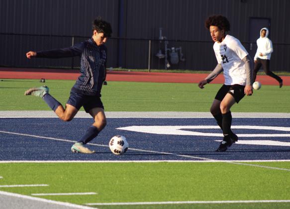 Shawnee’s Ivan Macias makes a corner kick during the April 2 game with Victory Christian. The Shawnee soccer teams were the first athletes to play on the new turf at Jim Thorpe Stadium. The Wolves lost, 0-1 in overtime, and the Lady Wolves lost, 0-6. Countywide &amp; Sun/Natasha Dunagan