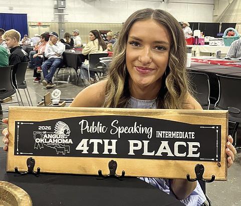 Madalyn Taron of Bethel holds her prize for fourth place in Intermediate Public Speaking at The Fuzion by NAJRAE in Woodward last month. Photo provided.