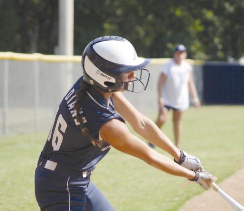 Asher senior Payton Leba hits a double and causes one run batted in (RBI) during the Asher Softball Tournament.