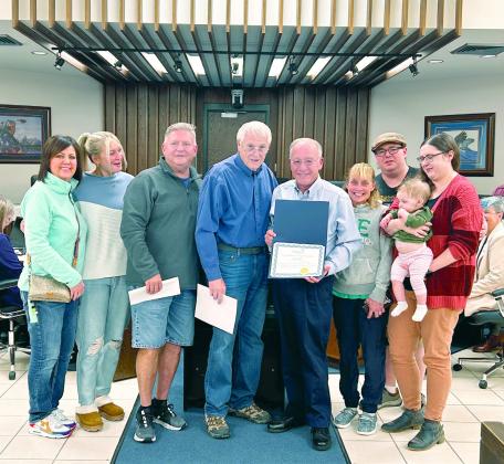 Mayor Ed Bolt presents a certificate of recognization to the family of Ann Davis who passed away in early Sept. Receiving the certificate is her son Trey surrounded by multiple family members. Countywide &amp; Sun/Suzie Campbell
