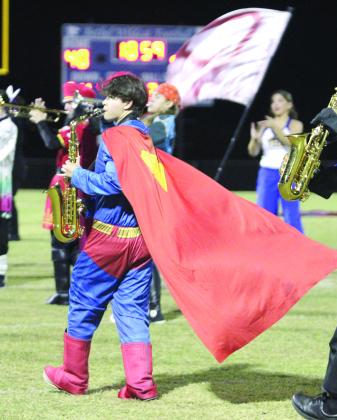 The Pride of Bethel Marching Band performs music from 'Superman' during halftime of the Oct. 31 homecoming game against Okmulgee. Bethel freshman Hugh Loftis, playing the alto saxophone, also dressed as Superman. The Bethel band recently received straight superior ratings at the Regional Band Compettion in Elgin, according to a Facebook post on the BHS page. Natasha Dunagan, Countywide &amp;amp; Sun