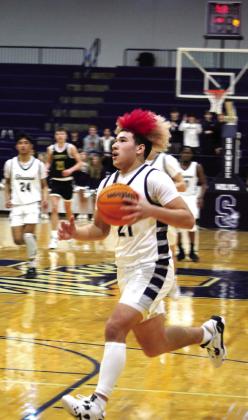 Having stolen the ball, Shawnee’s J.J. McClain drives to the basket during the game on Jan. 3.