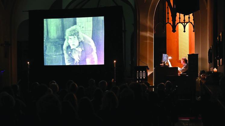 Dr. Ron Lewis plays organ to accompany the silent movie “The Hunchback of Notre Dame” at Emmanuel Episcopal Church in 2019. On Oct. 30, the Shawnee church will present “Nosferatu: a Symphony of Horror” at 7 pm. Photo provided.