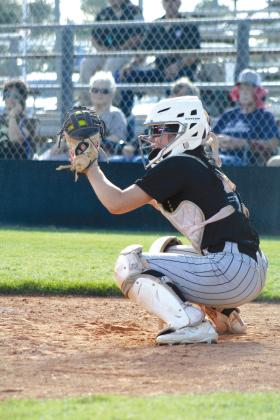 Tecumseh catcher Vivian Hayes traps the ball during the home game with Cleveland on Aug. 14. Countywide &amp; Sun/Natasha Dunagan