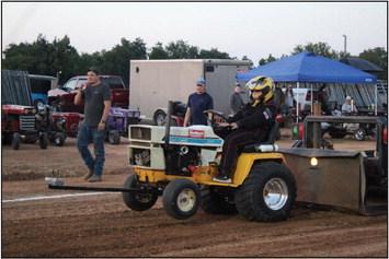 Madilynn Carter drives her Cub Cadet “Wild Child” during the Garden Tractor Pull at the Pottawatomie County Free Fair on Sept. 9. Countywide &amp; Sun/Natasha Dunagan