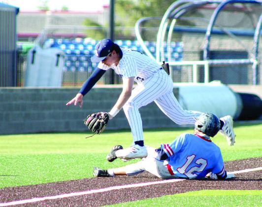 Shawnee freshman Tal Leone leaps over a player from Tulsa Memorial as he slides into third base. The Wolves won both games in the double header, 10-1 and 26-1. Natasha Dunagan, Countywide &amp; Sun