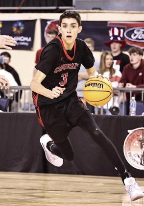 North Rock Creek's Cason Coomer drives the baseline towards the basket. Photo courtesy of Gowin Photography