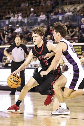North Rock Creek's Kohen Warden drives past the Bethany defender. Photo courtesy of Gowin Photography