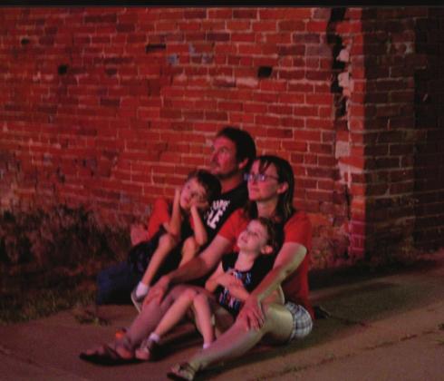 Jeff and Bobbi Howse, with their children, William, 7, and Sophia, 5, watch the Wanette fireworks show on July 4.