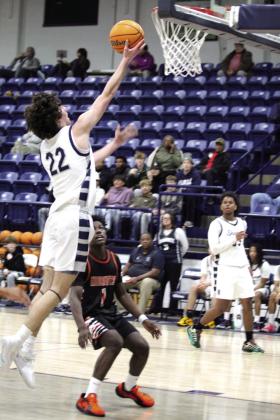 Shawnee sophomore Edan Litherland sinks his shot.