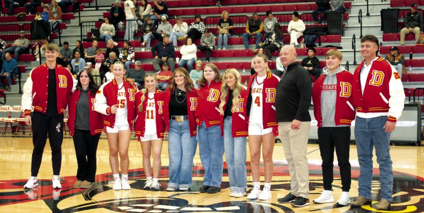 Dale held their academic letter jacket ceremony on Dec. 3 before their home basketball games. The jackets are earned by those making a 4.0 GPA or more, and they were paid for by BancFirst. Shown, from left, are Trayden Chambers, Scarlett Barnell, Teague Muncy, Kinsley Hill, Poppy Robinson, Eryn Woolridge, Macy Herman, Ava Bell, Ava’s father and BancFirst President Casey Bell, Levi Kelly and Jack Rooker. Countywide &amp;amp; Sun/Natasha Dunagan