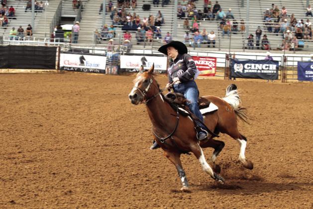 Sarah Holley of Charleville, Queensland, Australia, competes in barrel racing during the IFYR on the morning of July 17. Holley is the daughter of Leigh Holley. She also competes in pole bending.