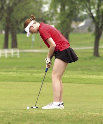 North Rock Creek junior Kimber Chesser putts at the 12th hole of FireLake Golf Course during the Tecumseh Girls Golf Tournament on April 14.