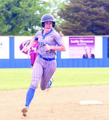 Josie MeGehee makes the rounds after hitting her first home run in the game against Byng on April 15. MeGehee brought in three runs with this hit to help Bethel secure the win 19-11. Bethel began district play at home on April 17.