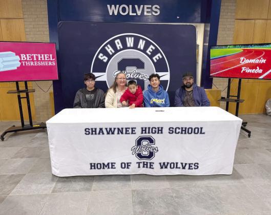 Along with his family, Shawnee student Damian Pineda signed a letter of intent with Bethel College for track and field on Apirl 30. Photo courtesy of Amanda Johnson