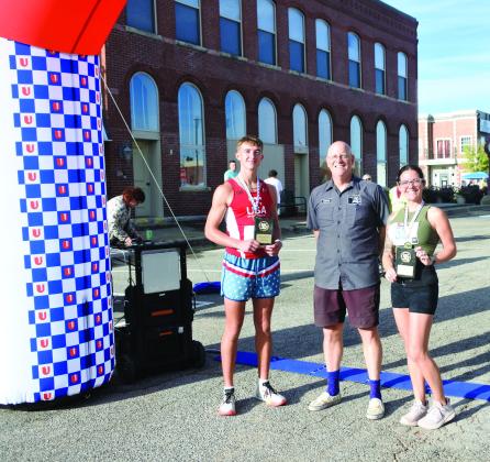 As the sun rose on Saturday morning, over 60 competitors gathered for the Justin Terney 5K. Elijah Pearman was the first to cross the finish line (pictured left) and was awarded first place for the mail competitors with a time of 17:30:50. Lexi Christensen took first for the female competitors (right) with a time of 20:38:24. The awards were presented by Craig McIntyre from spOKeLAHOMA who provided the timing equipment for the finish line. Countywide &amp; Sun/Suzie Campbell