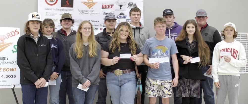 The top 12 winners of the Second Annual Pottawatomie County Cattlemen's Association Beef Quiz Bowl pose after being awarded between $400 and $2,700. They scored the highest on a multiple choice test given at the W.P. Wood THS Alumni Center on Nov. 4.
