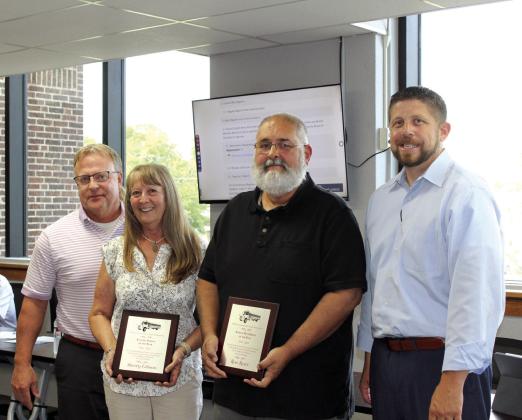 Two Shawnee Public Schools employees received awards from the Oklahoma Association of Pupil Transportation at a recent conference. They were recognized at the June 24 Shawnee Board of Education meeting. Sherry Gibson was named the OAPT Support Employee of the Year, and Ron Reser is the OAPT Bus Driver of the Year. Also shown are SPS Director of Operations Ron Stearns, far left, and Superintendent Dr. Aaron Espolt. Countywide &amp; Sun/Natasha Dunagan