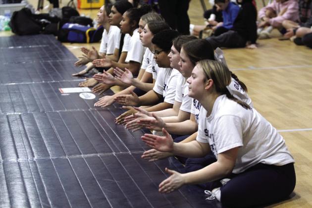 The Shawnee Wrestling Mat Maids pound out a beat during the home dual with Piedmont on Dec. 12. Countywide &amp; Sun/Natasha Dunagan
