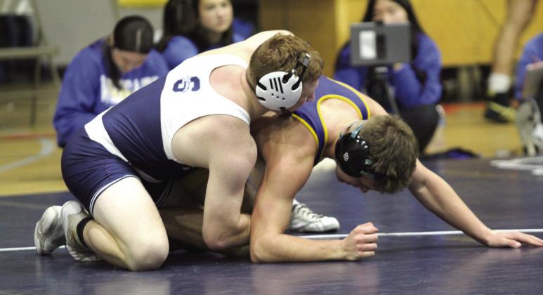In the 165 weight class, Shawnee's Chicago Herron, top, tries to flip his Piedmont opponent during the home dual on Dec. 12. The Wolves lost, 23-53, and the Lady Wolves won, 42-23. Countywide &amp; Sun/Natasha Dunagan