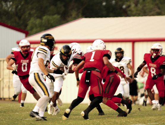 Tecumseh senior Jekhi Owens sidesteps the McLoud defense after catching a pass from junior Wyatt Dodgion during the game at McLoud on Sept. 19. The Tecumseh Savages won, 33-26. Natasha Dunagan, Countywide &amp;amp; Sun