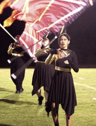 Natasha Dunagan, Countywide &amp;amp; Sun Right: Members of the Mc-Loud Redskin Regiment Color Guard perform at halftime of the homecoming game.