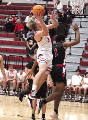 After a pass from Levi Kelly, Dale’s Denton Forsythe aims for the bucket and gets the foul during the third quarter of the Dec. 17 home game with Luther.
