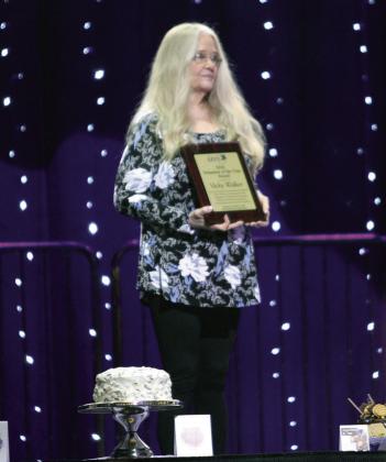 One of two Volunteer of the Year Awards was presented to Vicky Walker during the Honey Do Auction.