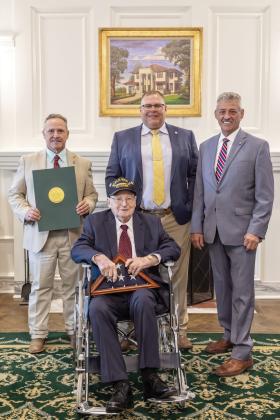 Pictured from left: Rep. Danny Sterling, World War II veteran Raymond Talley, Rep. Ty Burns, and Rep. John Talley. Photo provided