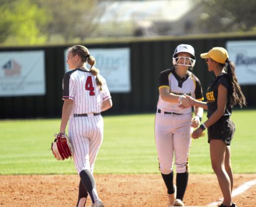 Tecumseh senior Kynlee Donaghey shakes hands with Assistant Coach Kayla Rodriguez after hitting a single in the home game with McLoud on April 7. Natasha Dunagan, Countywide &amp; Sun