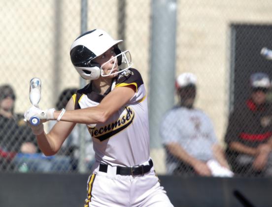 Tecumseh sophomore Haley Mansell concentrates on the ball before getting a hit in the home game with McLoud.