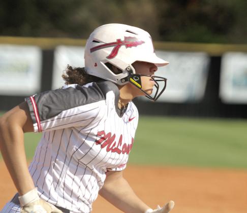 McLoud's Taycie Lewis runs for first in the game at Tecumseh against the Lady Savages.