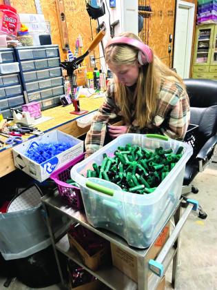 Bethel freshman Corley Steward resizes shotgun shells for her dad to reload. Photo provided.