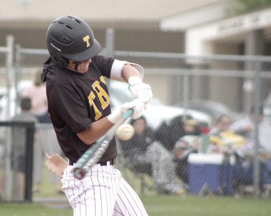 Tecumseh sophomore Wyatt Dodgion makes contact with the ball in the April 14 home game against Seminole. The Savages won, 8-0. Natasha Dunagan, Countywide &amp; Sun