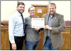 The Pioneer Library System Board of Trustees presented the City of McLoud with a certificate of appreciation at the May McLoud City Council meeting. PLS Regional Coordinator Lisa Lempges is pictured with Mayor McClure and City Manager Cody Roe.