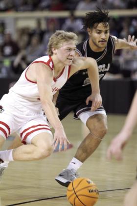 Dale junior Denton Forsythe guards the ball as he takes it up court during the Class 2A Basketball State Championship on March 8 at the State Fair Arena. The Pirates won against Cashion on March 6, 74-55; Fairland on March 7, 76-51; and, Pocola on March 8, 60-20, to take state for the fourth year straight. They end the season with a record of 30-2. Natasha Dunagan, Countywide &amp; Sun