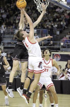 Dale senior Jett Higdon tries for two points while being blocked by a Pocola defender during the Class 2A Basketball State Championship on March 8 at the State Fair Arena. Also shown is sophomore Keldan Meely (#21). Natasha Dunagan, Countywide &amp; Sun
