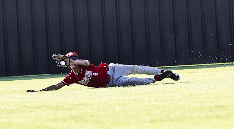 North Rock Creek's Owin Payne makes a sliding catch in center field for the out. Photo courtesy of Gowin Photography