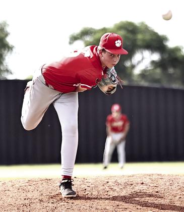North Rock Creek's Lane Scallorn keeps his eye on the ball. The team played its last summer league game Tuesday night against Harrah. They came up short against the Panthers, losing 2-12.